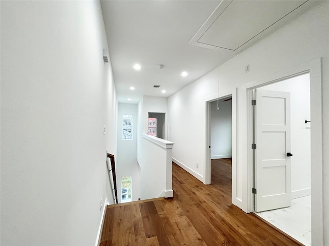 3038 Webster St, Houston, TX 77004 - corridor with baseboards, attic access, an upstairs landing, recessed lighting, and wood finished floors
