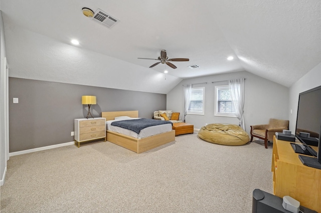 bedroom with vaulted ceiling, carpet flooring, baseboards, ceiling fan, and visible vents