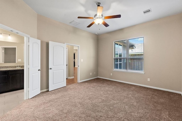 14356 N Summerchase Cir, Willis, TX 77318 - unfurnished bedroom with visible vents, baseboards, and ensuite bath