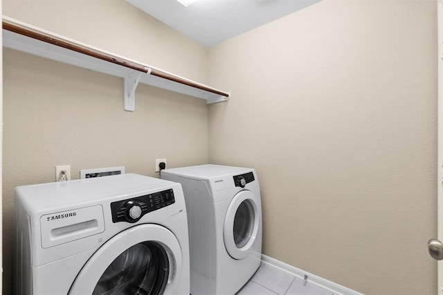 14356 N Summerchase Cir, Willis, TX 77318 - laundry room featuring laundry area, baseboards, light tile patterned floors, and separate washer and dryer