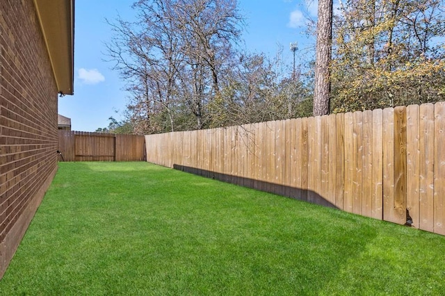 14356 N Summerchase Cir, Willis, TX 77318 - view of yard with a fenced backyard