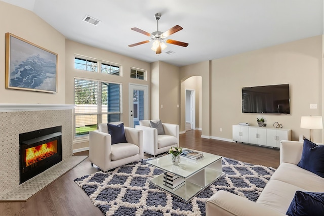14356 N Summerchase Cir, Willis, TX 77318 - living area with visible vents, arched walkways, a ceiling fan, and wood finished floors