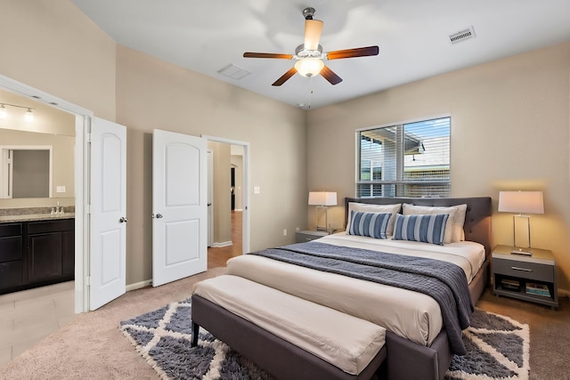 14356 N Summerchase Cir, Willis, TX 77318 - bedroom with a sink, a ceiling fan, ensuite bath, and visible vents