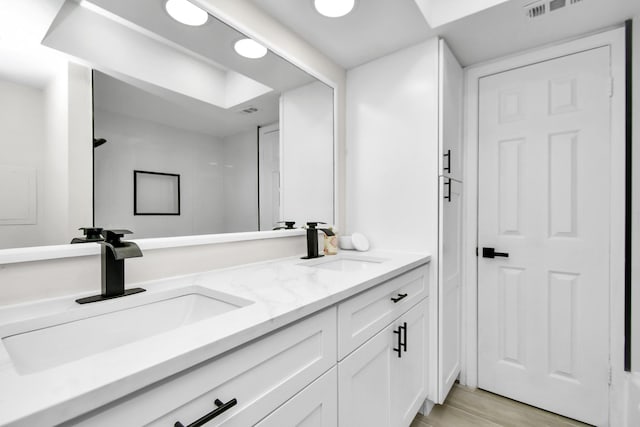 5510 Braesvalley, Houston, TX 77096 - full bath with double vanity and wood finished floors