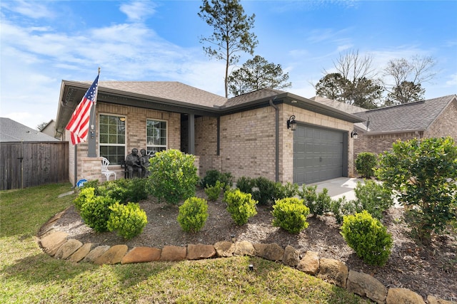 411 Wild Petunia Ct, Montgomery, TX 77316 - ranch-style home with fence, a garage, brick siding, and roof with shingles