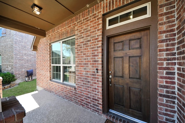 12427 Point Arbor Ct, Tomball, TX 77377 - view of exterior entry featuring brick siding and covered porch
