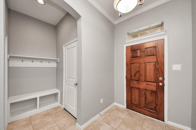 12427 Point Arbor Ct, Tomball, TX 77377 - foyer with light tile patterned floors, baseboards, arched walkways, and ornamental molding