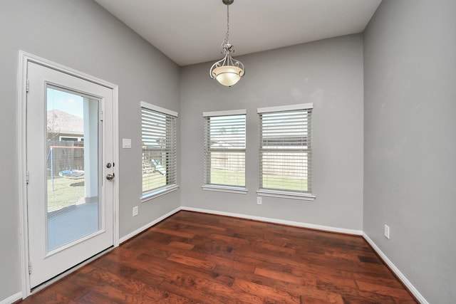 12427 Point Arbor Ct, Tomball, TX 77377 - unfurnished dining area featuring baseboards and wood finished floors