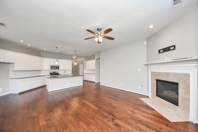 12427 Point Arbor Ct, Tomball, TX 77377 - interior space with stainless steel appliances, a sink, open floor plan, recessed lighting, and ceiling fan