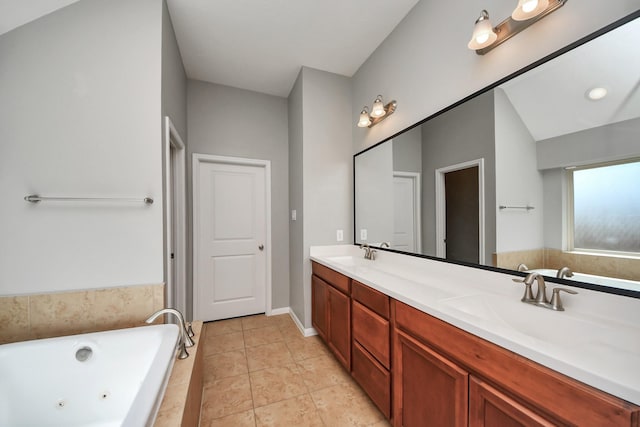 12427 Point Arbor Ct, Tomball, TX 77377 - bathroom featuring tile patterned flooring, a sink, double vanity, and a jetted tub