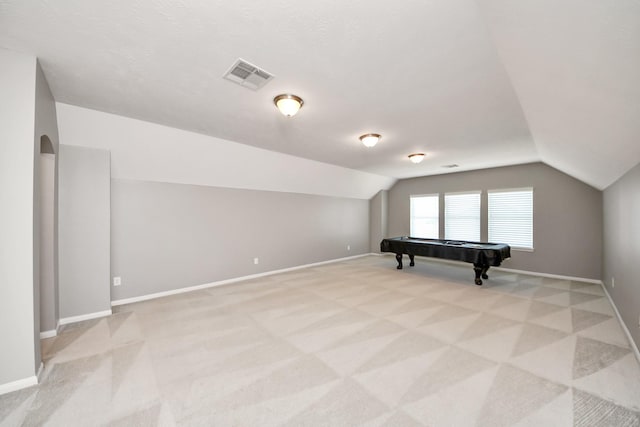 12427 Point Arbor Ct, Tomball, TX 77377 - additional living space with light colored carpet, vaulted ceiling, visible vents, and baseboards