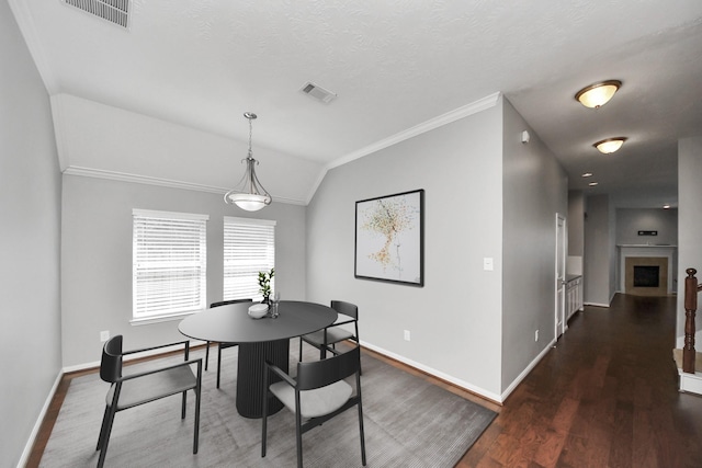 12427 Point Arbor Ct, Tomball, TX 77377 - dining area with lofted ceiling, visible vents, baseboards, and ornamental molding