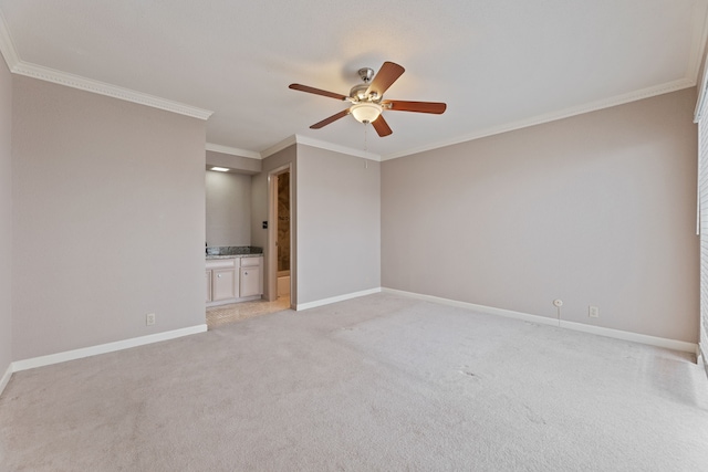 2323 Augusta Dr Unit 36, Houston, TX 77057 - empty room featuring crown molding, baseboards, a ceiling fan, and light carpet