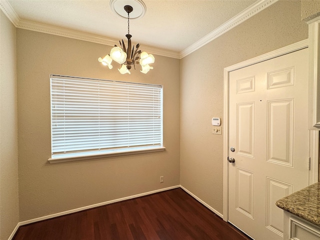 2323 Augusta Dr Unit 36, Houston, TX 77057 - unfurnished dining area featuring a chandelier, dark wood-type flooring, and ornamental molding