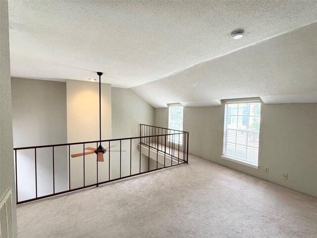 2323 Augusta Dr Unit 36, Houston, TX 77057 - bonus room with carpet flooring, a textured ceiling, and lofted ceiling