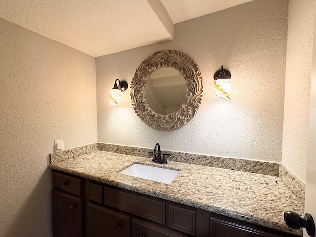 2323 Augusta Dr Unit 36, Houston, TX 77057 - bathroom with vanity and a textured wall