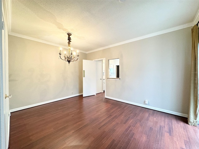 2323 Augusta Dr Unit 36, Houston, TX 77057 - spare room featuring a chandelier, dark wood finished floors, a textured ceiling, and ornamental molding