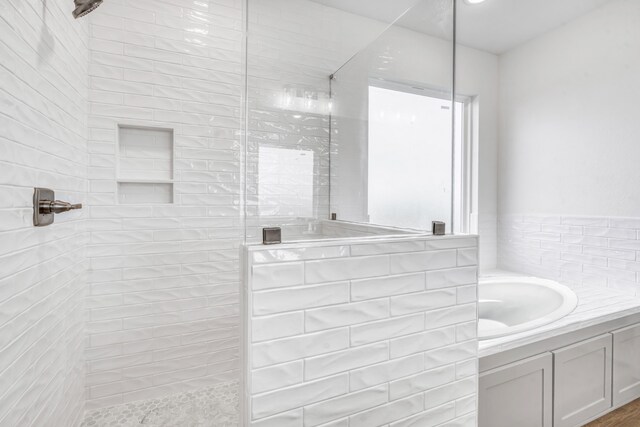 bathroom featuring vanity and walk in shower