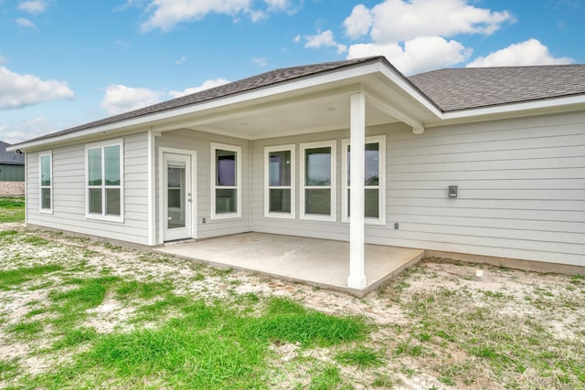 back of property with a patio area