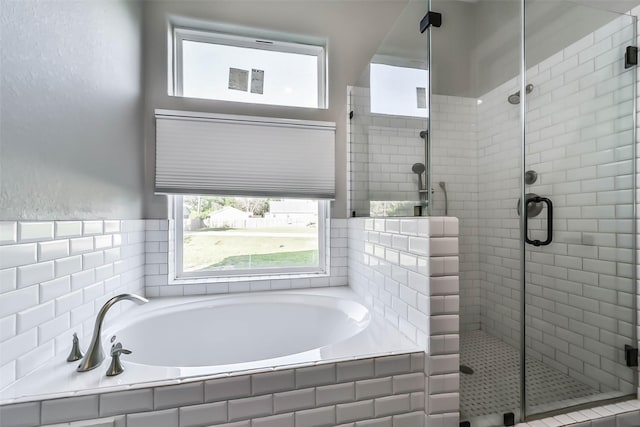 bathroom featuring a garden tub, visible vents, and a stall shower