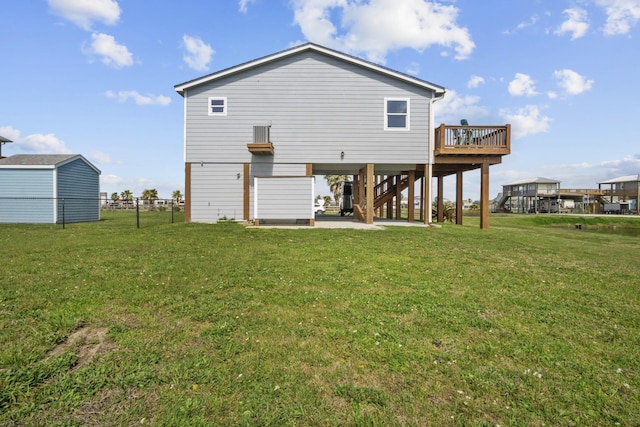 979 Sea Spray Dr, Crystal Beach, TX 77650 - back of house with a lawn, a patio, fence, a carport, and stairs