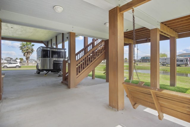 979 Sea Spray Dr, Crystal Beach, TX 77650 - view of patio with stairs and a water view