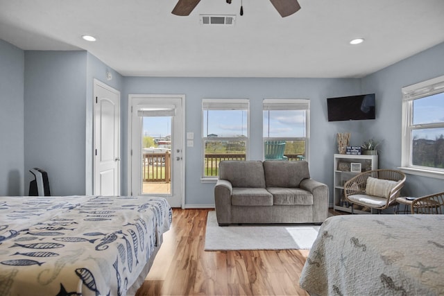 979 Sea Spray Dr, Crystal Beach, TX 77650 - bedroom with recessed lighting, visible vents, wood finished floors, and access to outside