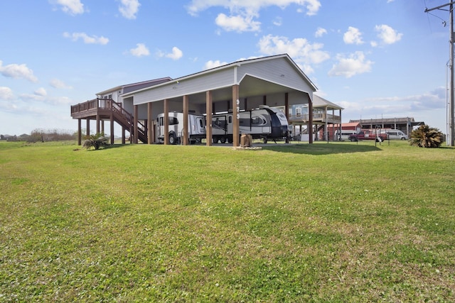 979 Sea Spray Dr, Crystal Beach, TX 77650 - rear view of property with a lawn
