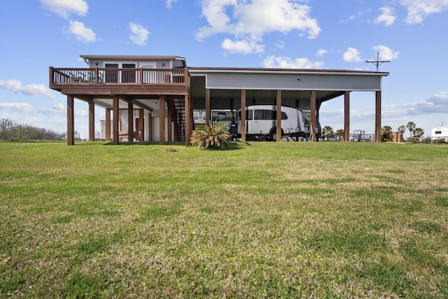 979 Sea Spray Dr, Crystal Beach, TX 77650 - rear view of house with a detached carport, stairway, a yard, and a deck