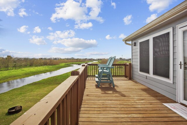 979 Sea Spray Dr, Crystal Beach, TX 77650 - wooden terrace with a water view