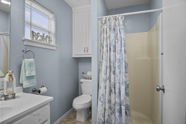 979 Sea Spray Dr, Crystal Beach, TX 77650 - bathroom featuring curtained shower, baseboards, toilet, tile patterned floors, and vanity