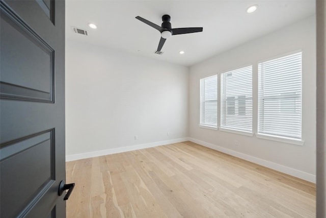 empty room featuring ceiling fan, visible vents, light wood-type flooring, baseboards, and recessed lighting