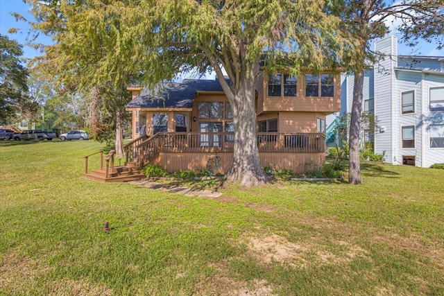 182 Cedar Hill Dr, Livingston, TX 77351 - back of property with a wooden deck and a yard
