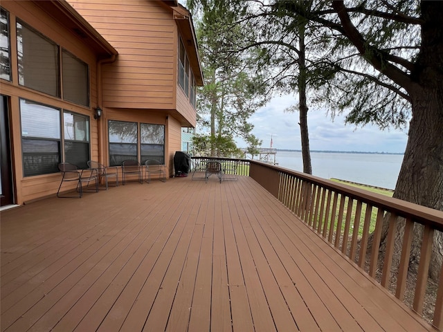 182 Cedar Hill Dr, Livingston, TX 77351 - wooden deck featuring area for grilling, outdoor dining area, and a water view