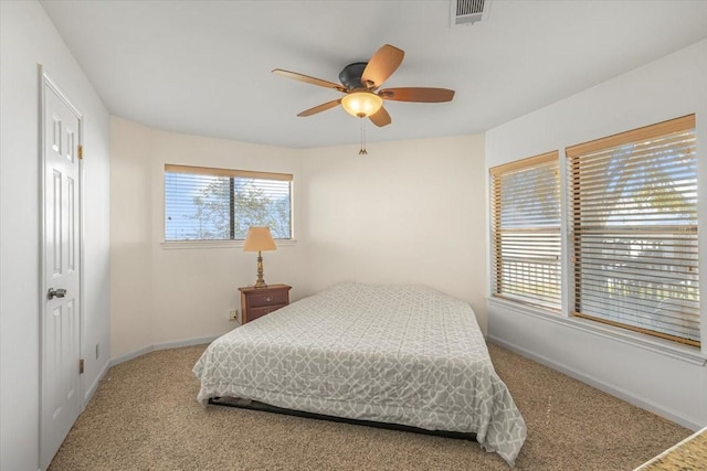 182 Cedar Hill Dr, Livingston, TX 77351 - carpeted bedroom featuring visible vents, baseboards, and a ceiling fan
