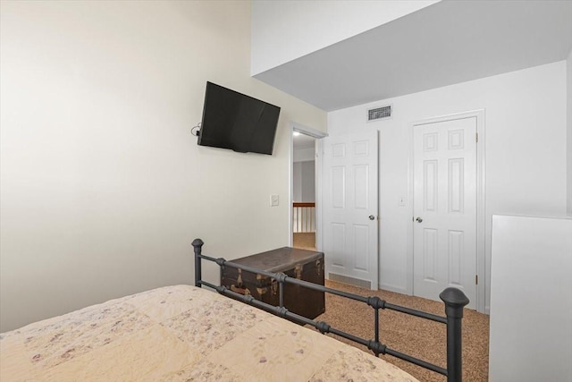 182 Cedar Hill Dr, Livingston, TX 77351 - bedroom featuring visible vents and carpet