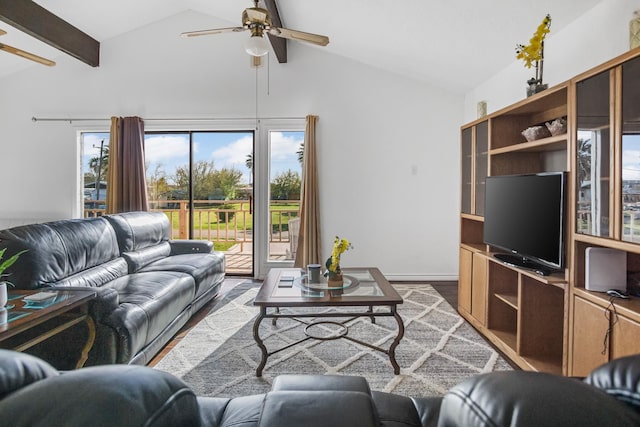 living area featuring lofted ceiling with beams, wood finished floors, and ceiling fan