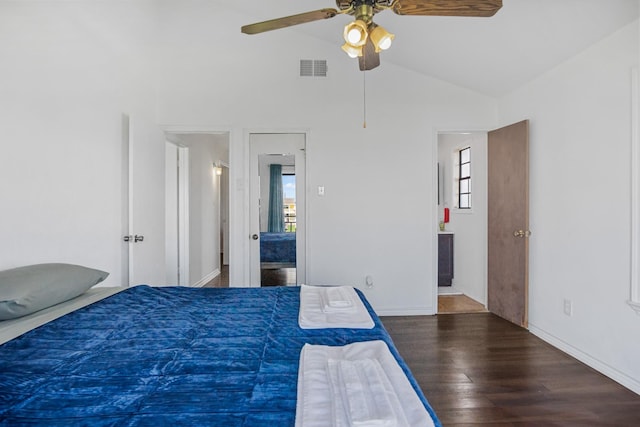 bedroom with a ceiling fan, wood finished floors, visible vents, vaulted ceiling, and connected bathroom