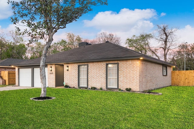 single story home with a front lawn, driveway, fence, a garage, and brick siding