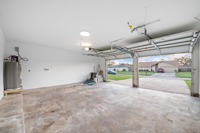 garage with a garage door opener and water heater