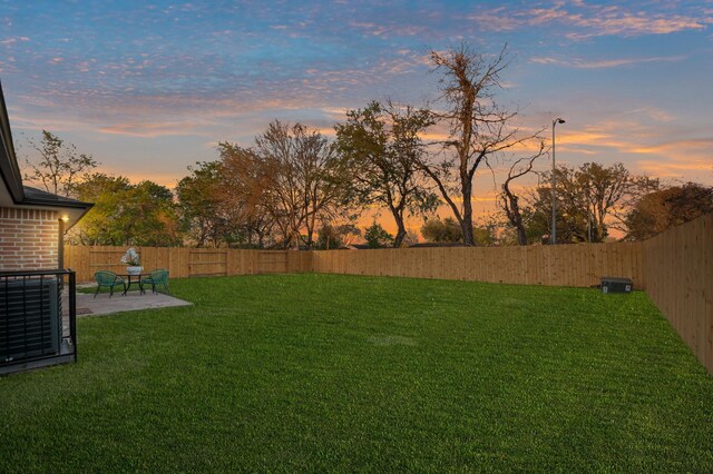 view of yard featuring a patio and a fenced backyard