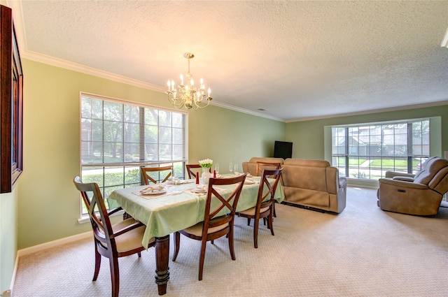dining space featuring a notable chandelier, light carpet, a textured ceiling, and crown molding