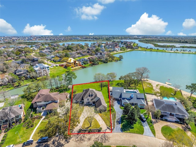 birds eye view of property featuring a water view and a residential view