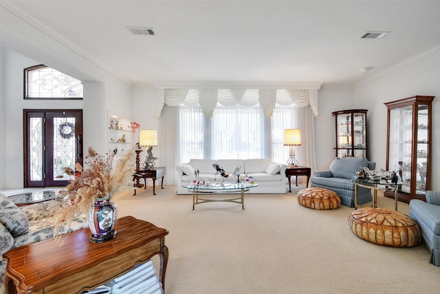 living room with visible vents, ornamental molding, and carpet