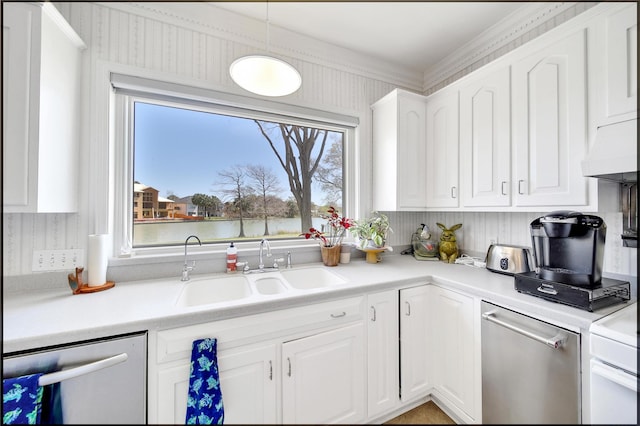 kitchen with stainless steel dishwasher, white cabinetry, a sink, and light countertops