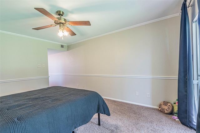 bedroom featuring visible vents, crown molding, baseboards, carpet, and a ceiling fan