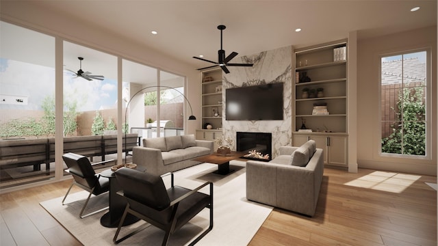 2244 N Blvd, Houston, TX 77098 - living area with recessed lighting, a high end fireplace, light wood-style flooring, built in shelves, and ceiling fan