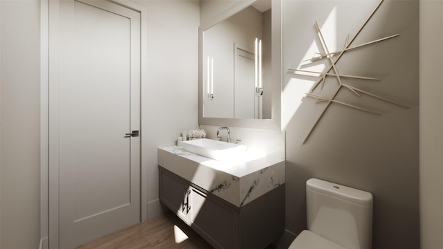 2244 N Blvd, Houston, TX 77098 - bathroom with wood finished floors, toilet, and vanity