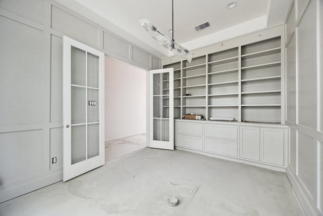 2244 N Blvd, Houston, TX 77098 - empty room with french doors, visible vents, and built in features