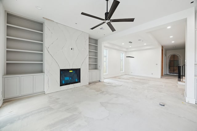2244 N Blvd, Houston, TX 77098 - unfurnished living room with concrete floors, ceiling fan, built in features, a premium fireplace, and recessed lighting